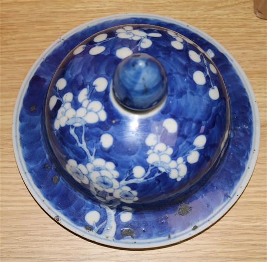 A Chinese blue and white prunus pattern vase and cover, Kangxi mark, 47cms (a.f.)